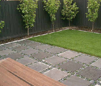 Besser Block Centre's LAVA STONE pavers laid with loose pebbles for a less formal finish