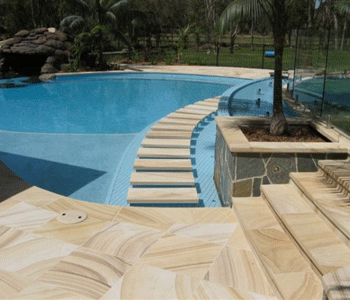 Besser Block Centre's SANDSTONE adds an elegant contrast when used as a pool surround, paving or as a veneer  on adjoining walls