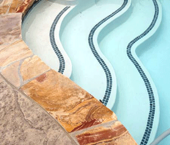 Besser Block Centre's SANDSTONE adds an elegant contrast when used as a pool surround, paving or as a veneer  on adjoining walls