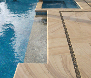 Besser Block Centre's SANDSTONE adds an elegant contrast when used as a pool surround, paving or as a veneer  on adjoining walls